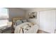 Inviting bedroom with a large window, soft carpeting and comfortable bedding. with closet at 4258 Eastminster Rd, Davenport, FL 33837