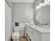 Bathroom featuring a bright vanity, a round mirror and white subway tile at 4306 Lake Underhill Rd # C, Orlando, FL 32803