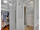 Hallway bathroom featuring a walk in shower, closet and light fixtures at 4306 Lake Underhill Rd # C, Orlando, FL 32803