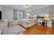 Bedroom with hardwood floors, bright natural light, and white furniture at 4306 Lake Underhill Rd # C, Orlando, FL 32803