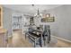 Inviting dining area with modern table set and seamless flow into the kitchen, perfect for Gathering meals at 4306 Lake Underhill Rd # C, Orlando, FL 32803