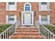 A beautiful brick house with a white front door, flanked by white-framed windows, and a lovely brick stairway entrance at 4306 Lake Underhill Rd # C, Orlando, FL 32803