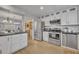 A beautifully updated kitchen with stainless steel appliances, white cabinets, and stylish countertops at 4306 Lake Underhill Rd # C, Orlando, FL 32803