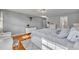 Spacious bedroom featuring wood floors, a white bed frame, and stylish decor at 4306 Lake Underhill Rd # C, Orlando, FL 32803