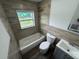 Updated bathroom with modern vanity, tile surround, and tub at 506 South St, Daytona Beach, FL 32114