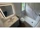 Modern bathroom features stylish tile shower and updated vanity with mirror at 506 South St, Daytona Beach, FL 32114