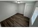 This bedroom features new hardwood floors, white walls and updated lighting at 506 South St, Daytona Beach, FL 32114