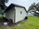 Rear exterior of home with stucco and mature tree at 506 South St, Daytona Beach, FL 32114