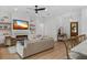 Bright living room featuring a fireplace, hardwood floors, recessed lighting and open to entry and kitchen at 5237 Haverill Dr, Orlando, FL 32809