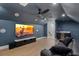 Spacious media room with large screen TV, comfortable seating, and snack area at 5237 Haverill Dr, Orlando, FL 32809