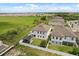 Aerial view of a backyard with a modern pergola and manicured lawn, ideal for outdoor living at 5700 Iron Brand Rd, St Cloud, FL 34771