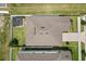 Aerial view of a well-maintained home with a spacious backyard and stylish pergola at 5700 Iron Brand Rd, St Cloud, FL 34771
