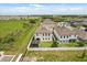 Home with a spacious backyard featuring a modern pergola, perfect for outdoor entertaining at 5700 Iron Brand Rd, St Cloud, FL 34771