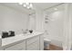 White bathroom featuring modern vanity, sink, and shower/tub combination at 5700 Iron Brand Rd, St Cloud, FL 34771