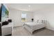 Clean bedroom with neutral carpet and white walls and a view to the outside at 5700 Iron Brand Rd, St Cloud, FL 34771
