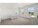 Bright bedroom with carpet, two windows, and crib at 5700 Iron Brand Rd, St Cloud, FL 34771