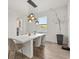 Stylish dining room with modern lighting and a sleek, minimalist design at 5700 Iron Brand Rd, St Cloud, FL 34771