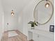 Bright hallway with elegant lighting and stylish console table at 5700 Iron Brand Rd, St Cloud, FL 34771