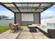 Inviting outdoor space with pergola, dining table, and a sectional sofa perfect for relaxing at 5700 Iron Brand Rd, St Cloud, FL 34771