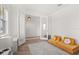 Bright play room with plush yellow seating and modern flooring at 5700 Iron Brand Rd, St Cloud, FL 34771