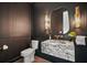 Modern powder room with unique marble sink and elegant fixtures at 5700 Iron Brand Rd, St Cloud, FL 34771