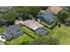 Aerial view of the property showcasing the pool, lanai, and manicured lawn at 5950 Blakeford Dr, Windermere, FL 34786