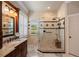 Bathroom features a spacious shower with marble floors and a beautiful granite vanity at 5950 Blakeford Dr, Windermere, FL 34786