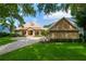 Attractive exterior with a spacious driveway and a welcoming front porch at 5950 Blakeford Dr, Windermere, FL 34786