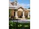 Charming front porch with stately columns and stone accents on this beautiful home at 5950 Blakeford Dr, Windermere, FL 34786