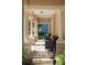 Inviting front porch with comfortable seating and elegant columns at 5950 Blakeford Dr, Windermere, FL 34786