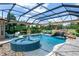 Screened-in pool with spa, waterfall, and golf course views offers a private oasis at 5950 Blakeford Dr, Windermere, FL 34786
