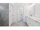 Neutral modern bathroom with a walk-in shower and double vanity at 6062 Sw 154Th Pl, Ocala, FL 34473