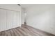 Bedroom features a closet, wood-look floors, and neutral walls at 6062 Sw 154Th Pl, Ocala, FL 34473