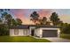 Charming single-story home with a well-maintained lawn and a two-car garage at 6062 Sw 154Th Pl, Ocala, FL 34473