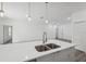 Open concept kitchen with large island and stainless steel faucet at 6062 Sw 154Th Pl, Ocala, FL 34473