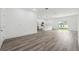 Bright open living area with laminate floors and modern design elements at 6062 Sw 154Th Pl, Ocala, FL 34473