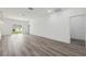 Spacious living area with laminate flooring and modern design at 6062 Sw 154Th Pl, Ocala, FL 34473