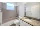 Functional bathroom features a granite vanity, ample lighting, and shower/tub combination at 704 Pickfair Ter, Lake Mary, FL 32746
