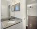 Bright bathroom with granite countertop and mirror over single vanity at 704 Pickfair Ter, Lake Mary, FL 32746