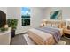 Modern bedroom with a queen-size bed, stylish decor, and a large window offering plenty of natural light at 704 Pickfair Ter, Lake Mary, FL 32746