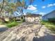 Single-story home with a two-car garage, well-maintained landscaping, and a brick-paved driveway at 704 Pickfair Ter, Lake Mary, FL 32746