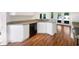 Bright kitchen features white cabinets, granite countertops, and stainless steel appliances at 704 Pickfair Ter, Lake Mary, FL 32746