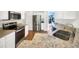 Modern kitchen with stainless steel appliances, granite countertops, and wood-look flooring at 704 Pickfair Ter, Lake Mary, FL 32746