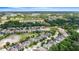Neighborhood aerial view of the community with lush trees and a pond at 808 Sherbourne Cir, Lake Mary, FL 32746