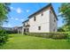 Spacious backyard with manicured hedge, providing privacy and a green backdrop at 808 Sherbourne Cir, Lake Mary, FL 32746