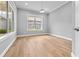 Empty bedroom showcasing natural light, with hardwood flooring at 808 Sherbourne Cir, Lake Mary, FL 32746
