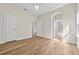 Bright bedroom with hardwood floors, white trim, and ensuite bathroom access; plenty of natural light at 808 Sherbourne Cir, Lake Mary, FL 32746