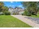 Stately two-story home with a three-car garage and a paved driveway at 808 Sherbourne Cir, Lake Mary, FL 32746