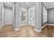 A bright foyer with a decorative glass front door, adjacent to the living spaces at 808 Sherbourne Cir, Lake Mary, FL 32746