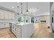 Modern kitchen with a large center island, stone countertops, and stainless steel appliances at 808 Sherbourne Cir, Lake Mary, FL 32746